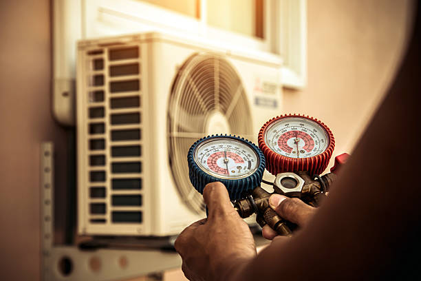 Professional Air Conditioning Service technician working in Herriman, UT